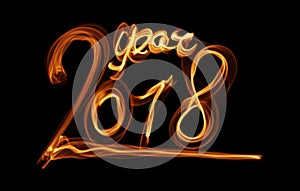 Happy new year 2018 isolated numbers lettering written with fire flame or smoke on black background