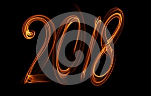Happy new year 2018 isolated numbers lettering written with fire flame or smoke on black background