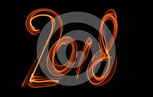 Happy new year 2018 isolated numbers lettering written with fire flame or smoke on black background