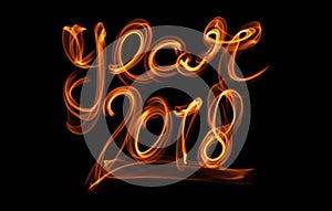 Happy new year 2018 isolated numbers lettering written with fire flame or smoke on black background