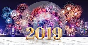 Happy new year 2019 3d rendering fireworks over cityscape at night with empty white marble table,Banner mock up template for