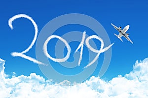 Happy New year 2019 concept. Drawing by plane vapor contrail in sky