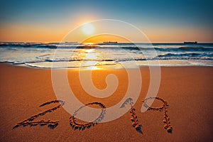 Happy New Year 2019 concept, lettering on the beach. Sea sunrise