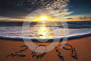 Happy New Year 2019 concept, lettering on the beach. Sea sunrise