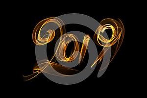 Happy new year 2019 isolated numbers lettering written with fire flame or smoke on black background