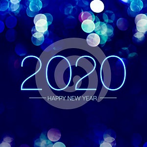 Happy new year 2020 with blue bokeh light sparkling on dark blue purple background,Holiday greeting card