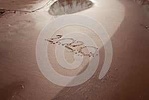 Happy New Year 2020 concept, 2020 number lettering on the sea beach,