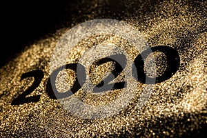 Happy New Year 2020. Creative Collage of numbers two and zero made up the year 2020. Beautiful sparkling Golden number 2020 on
