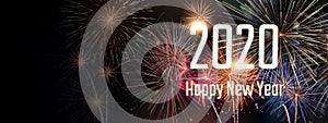 Happy new year 2020 with fireworks on dark background.