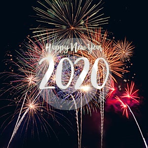 Happy new year 2020 with fireworks on dark background.