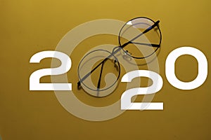 Happy New Year 2020 with Glasses isolated on yellow background