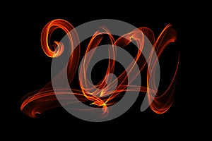 Happy new year 2020 isolated numbers lettering written with fire flame or smoke on black background