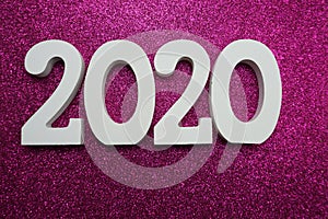 Happy New year 2020 with space copy on pink glitter background