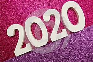 Happy New year 2020 with space copy on pink and purple glitter background