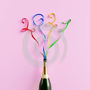 Happy New Year 2021. Champagne bottle with colourful party streamers making numbers of 2011 year. 3D render.