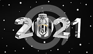 Happy new Year 2021, flag Juventus Football Club on a christmas toy, decorations isolated on dark background. Creative christmas