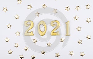 Happy New Year 2021. Sparkling gold numbers on white background with gold stars