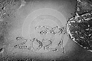 Happy new year 2021 text by the sea. Selective focus. Abstract background photography of the approaching New Year 2021 and the out