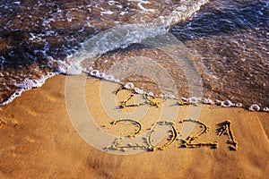 Happy new year 2021 text by the sea. Selective focus. Abstract background photography of the approaching New Year 2021 and the out