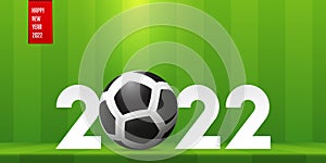 Happy New Year 2022 banner with soccer ball on soccer field background. Banner template design for New Year decoration.