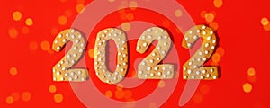 Happy New Year 2022. Christmas, winter holidays concept. Gingerbread cookies Number on traditional red background, fleyer,