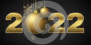 Happy new year 2022. Golden glittering numbers with sequins and decorations of Christmas hanging balls, stars and snowflakes on a