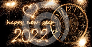 Happy new year 2022 greeting with clock ticking. golden bright modern sparkler number and letter isolated  black. silvester eve