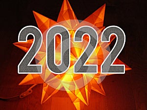 Happy New Year 2022 With Neon Lights Star On Night And Darkness Background.