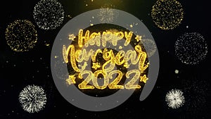 Happy New Year 2022 text wish on gold particles fireworks display.