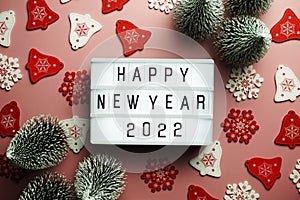 Happy New Year 2022 word in light box on pink background
