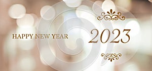 Happy New Year 2023 on blur abstract bokeh background, new year greeting card, banner