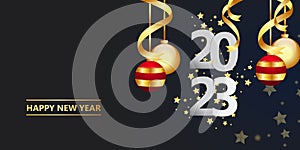 Happy new year 2023.golden Christmas decoration and confetti on background.