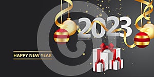 Happy new year 2023.golden Christmas decoration and confetti on background.