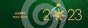 Happy New Year 2023. Golden metal 3D numbers 2023 with gold shining 3D snowflake in a Christmas glass bauble. Greeting card.