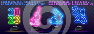 Happy new year 2023 in neon style. Set of bunny in simple one line style. Bunny icon on a color spot. 2023 year of the