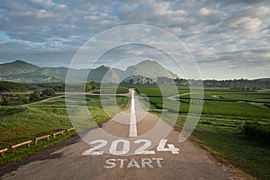Happy new year 2024,2024 symbolizes the start of the new year. The letter start new year 2024 on the road in the nature fresh