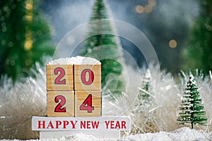 Happy New Year 2024 with Christmas tree winter holiday festive background