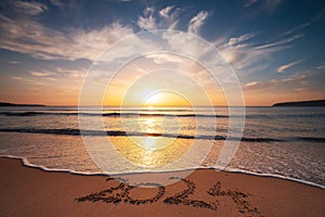 Happy New Year 2024 concept, lettering on the beach. Written text on the sea beach at sunrise