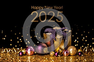 Happy New Year 2024! Golden gift box and christmas balls on golden background