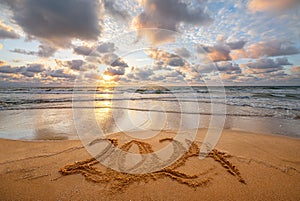 Happy New Year 2024 ocean sunrise on the beach. Written text on the sea beach at sunrise