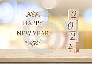 Happy New Year 2024 on wood cube block and blur abstract bokeh light background, Happy new year 2024 greeting card, banner