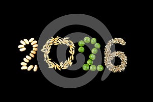 Happy New Year 2026- number made of beans, peas, grains on black wooden background