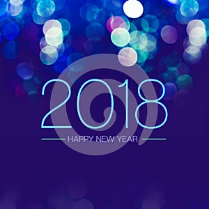 Happy new year 2018 with blue bokeh light sparkling on dark blue