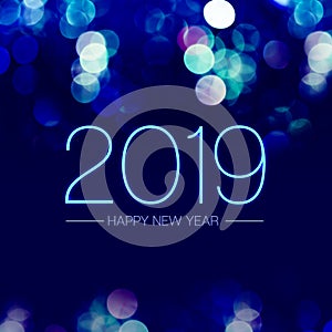 Happy new year 2019 with blue bokeh light sparkling on dark blue purple background,Holiday greeting card.