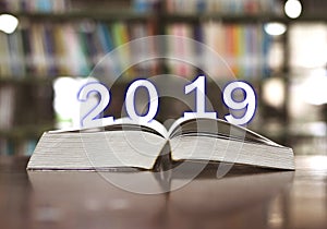 Happy New Year 2019 on books in the library.