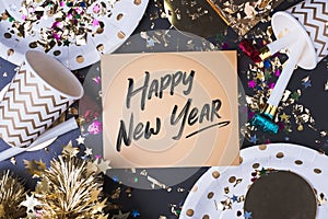Happy new year brush stroke handwriting on golden greeting card