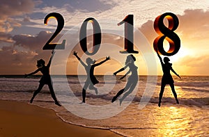 Happy new year card 2018. Silhouette young woman jumping on tropical beach over the sea and 2018 number with sunset background