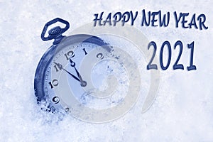 Happy new year card, New Year 2021 greeting in English language, pocket watch in snow, happy new year 2021 text, countdown to midn