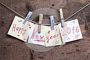 Happy New Year card on wooden surface