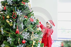 Happy new year. Children opening presents on Xmas eve. Merry Christmas and Happy new year